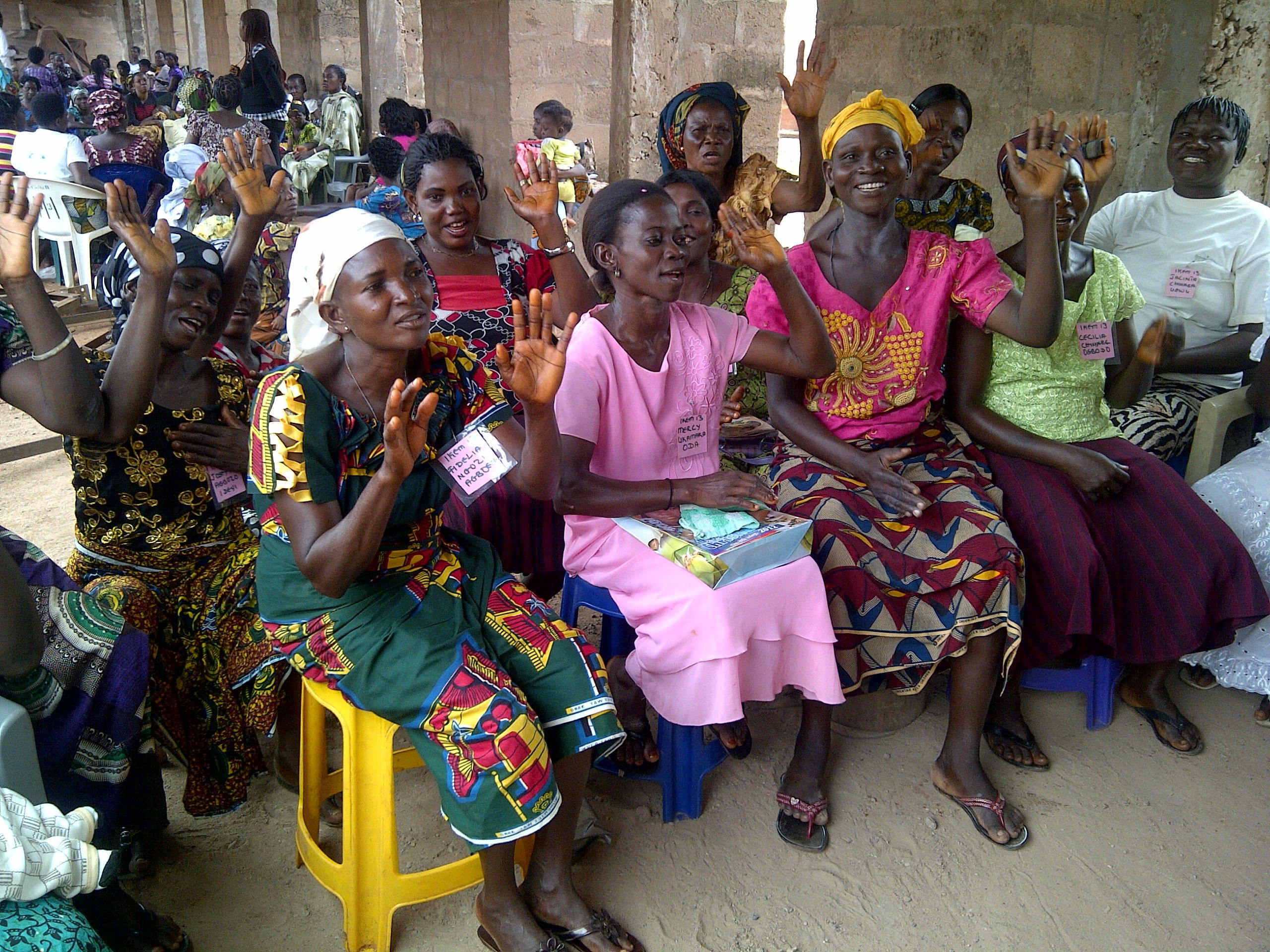 Participants gather together in a Women for Women training center