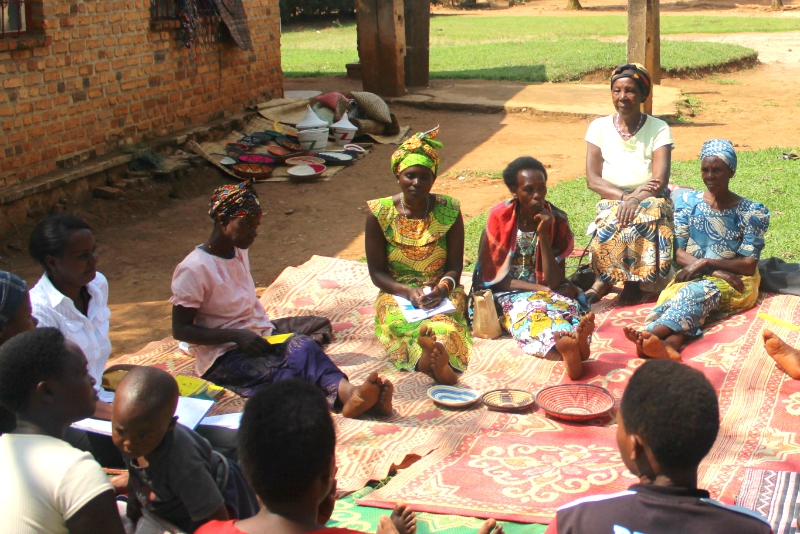 Program graduates in Rwanda come together to form a Village Savings and Loan Association 