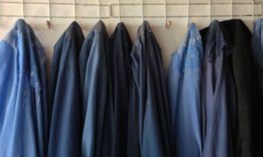 burkas hanging up on a wall