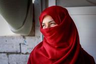 Woman in red head scarf