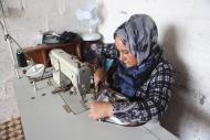 Shireen, Women for Women International-Iraq participant, runs a sewing business from her home. Many self-employed women and traders are being hit hard by the closure of markets. Photo: Alison Baskerville