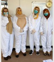 Women for Women International staff in Afghanistan, dressed for packing kits