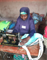 Hassana creating some of her wares at a sewing machine