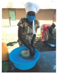 Lilian, a program participant in South Sudan, practicing her vocational skill