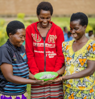 Jan, Chantel, and Marrietta are part of a savings group in Rwanda.