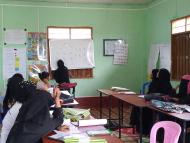 Rohingya women in Myanmar meet at a community learning center for Foundational Life Skills 