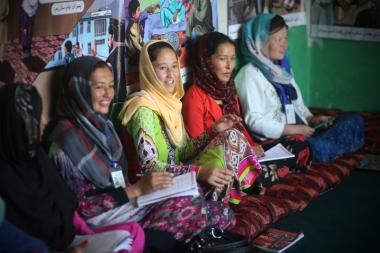Afghanistan women sitting together taking notes