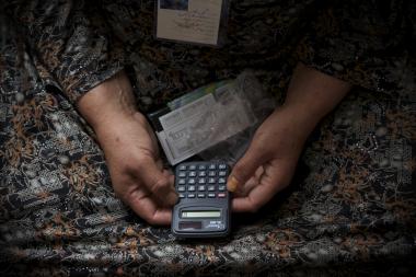 Womans hands holding calculator