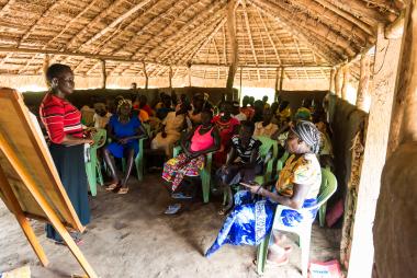 Women participants of a Social Empowerment class in South Sudan stand together for a class photo. They spent the session learning about gender equality in the household.