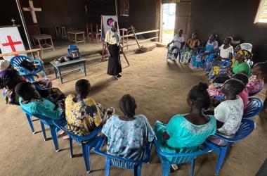 Lilian Kiden speaking to women