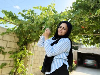 Delberin at her temporary home in a refugee camp