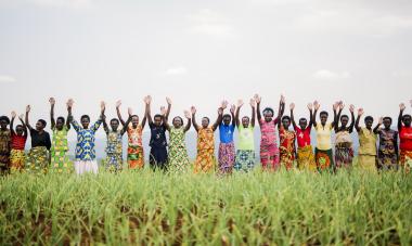 Rwanda - women raising hands in the air
