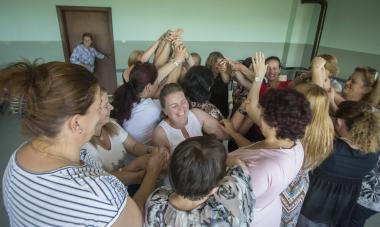 Kosovo - women in group hugging 