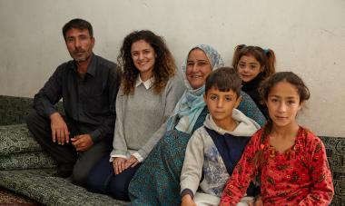 Shan with a participant and family in Iraq. Photo credit: Aidan O'Neill