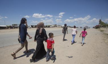 Displaced Yezidi woman, Seve, and her family. Photo credit: Alison Baskerville