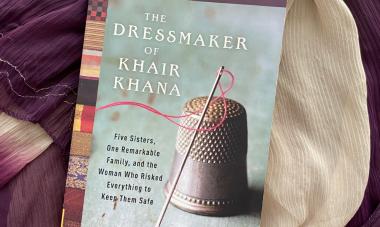 Photograph of paperback copy of The Dressmaker of Khair Khana