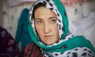 Emotive woman in green headscarf from Kabul, Afghanistan