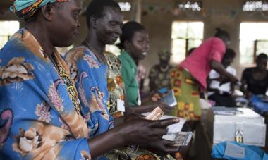 WFWI training group in Jigomoni. Women of the Jigomoni training group attend a savings group meeting.