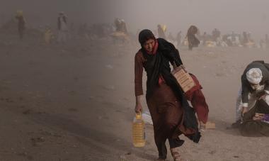 Afghan woman in dust storm in Herat