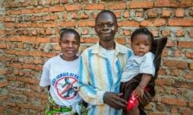 man with children looking at camera 