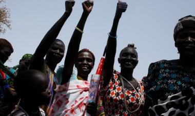 women smiling with fist in the air