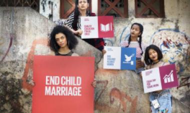 women standing with protest signs 