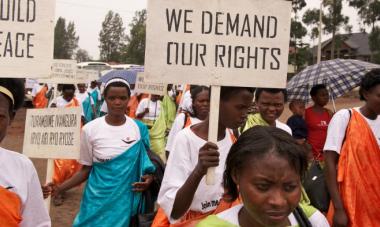 women marching holding signs