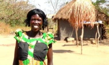 woman smiling at the camera in a green dress