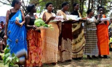 women reading poem at program graduation 