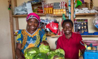 two women pictured in store with lettuce