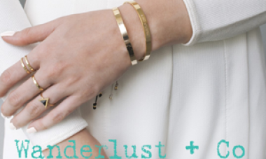 close up of hand wearing rings and bracelets 