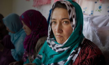 afghan woman green scarf