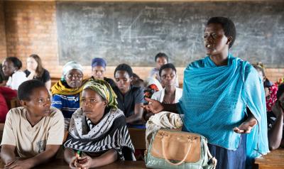 Rwanda - woman standing to speak in class