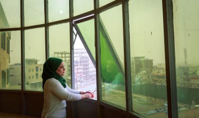 KRI - woman looking out of window