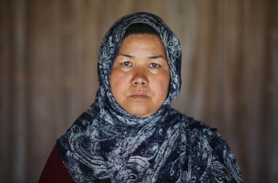Afghan woman looking into the camera