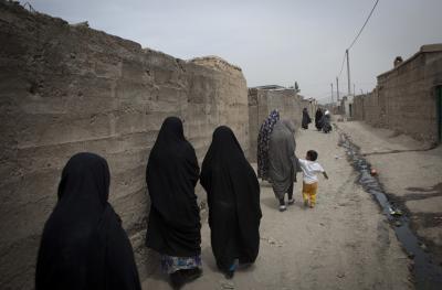 Woman walking in black burqas