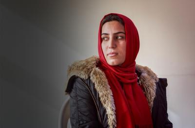 woman in red headscarf iraq