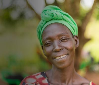 smiling woman in green headwrap