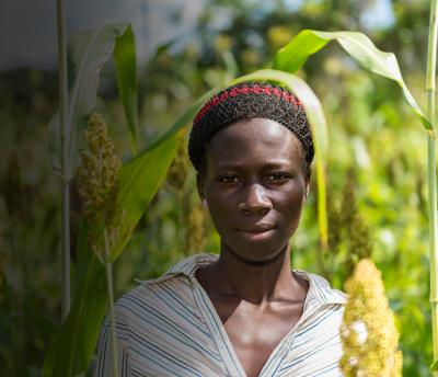 South Sudan woman in field homepage hero with fade