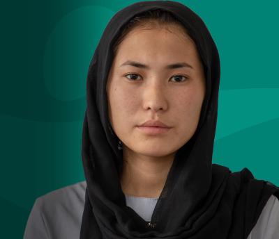Young Afghan Woman Direct Eye Contact Teal Background