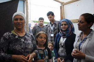 picture of women, children and men in Syria